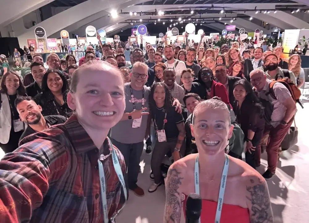Out at UNBOUND group gathered together smiling and taking a selfie at UNBOUND