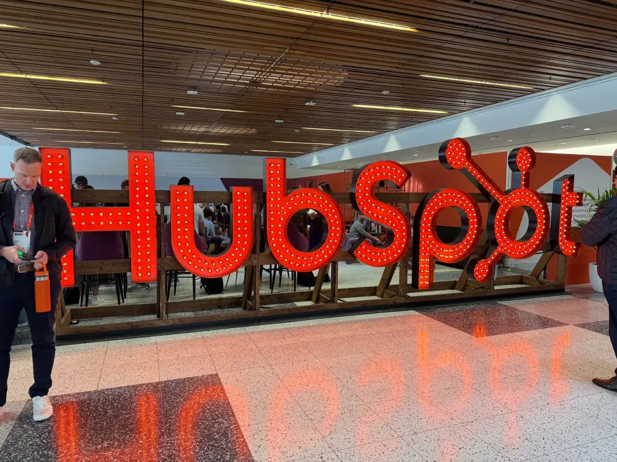 Large illuminated orange HubSpot sign at the UNBOUND conference center